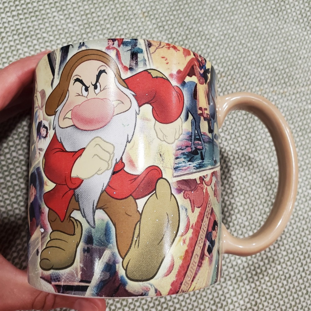 Walt Disney World Snow White Seven Dwarfs Grumpy Collage Coffee Mug Tan 4in